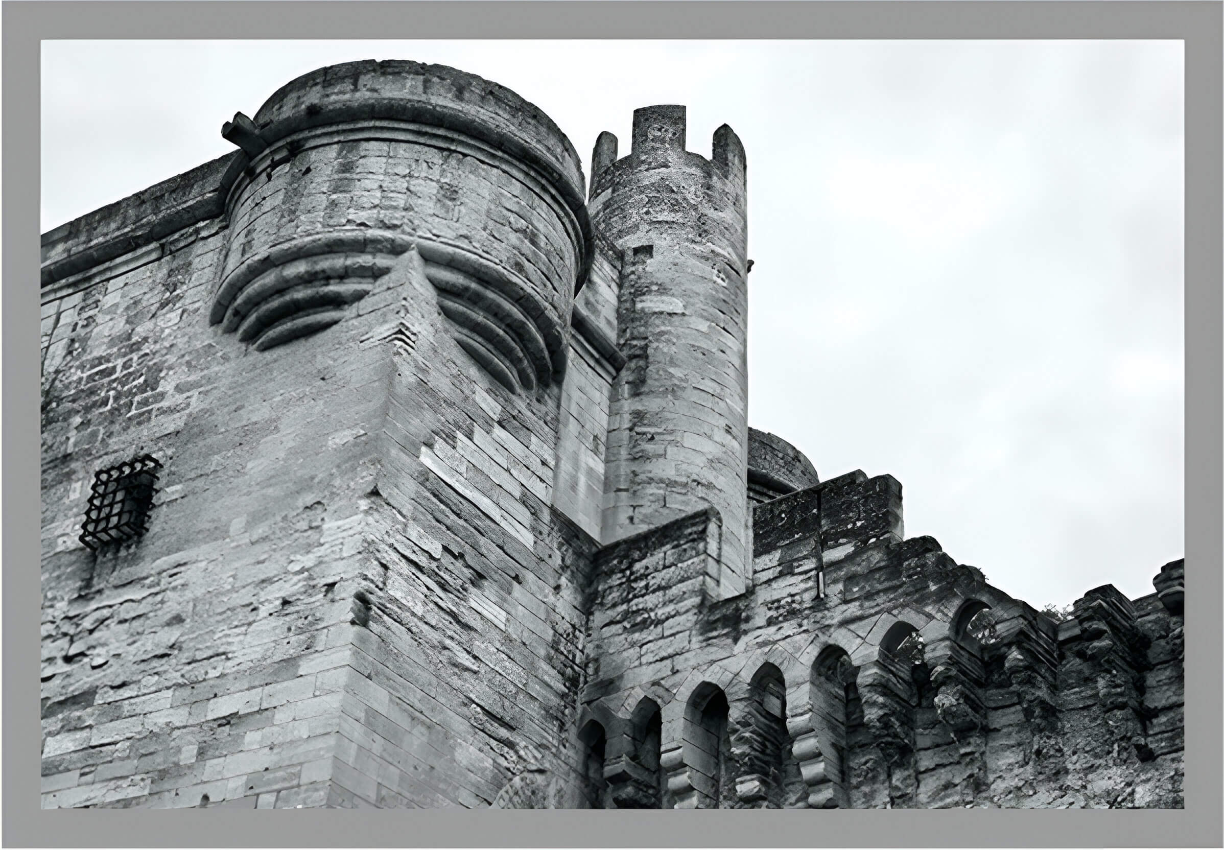 A black and white photo of an old castle.