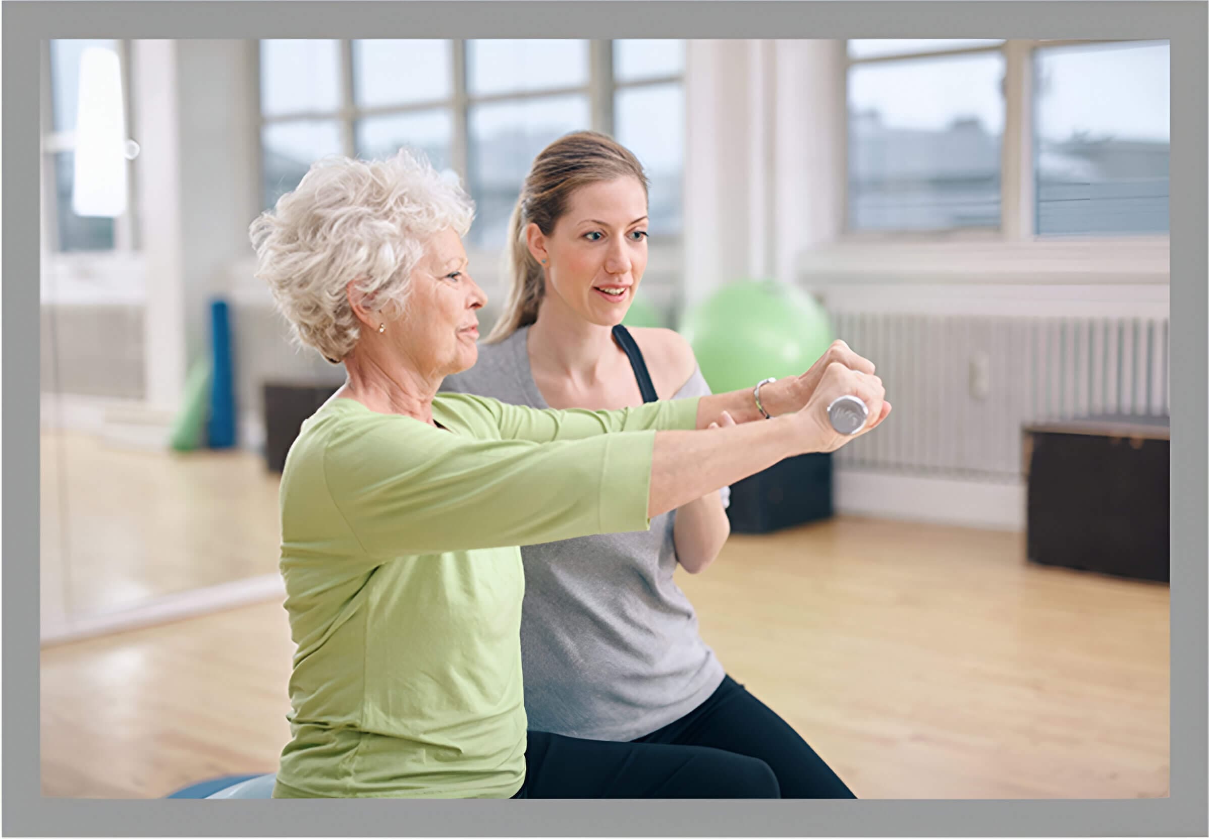 A woman and an older person are doing exercises.