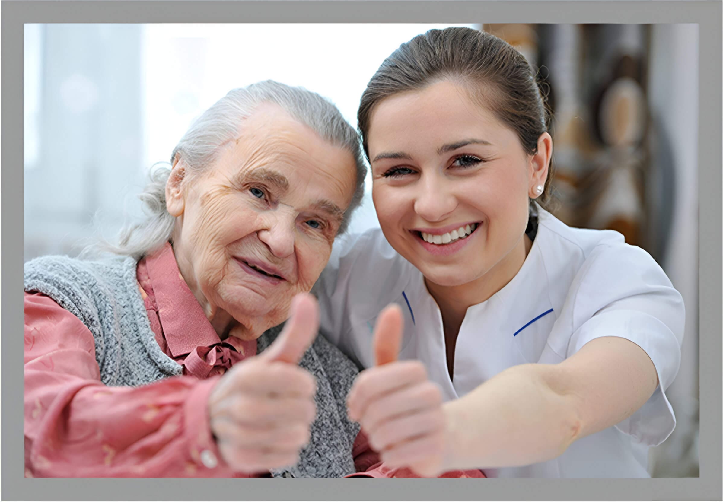 A woman and an old lady giving thumbs up