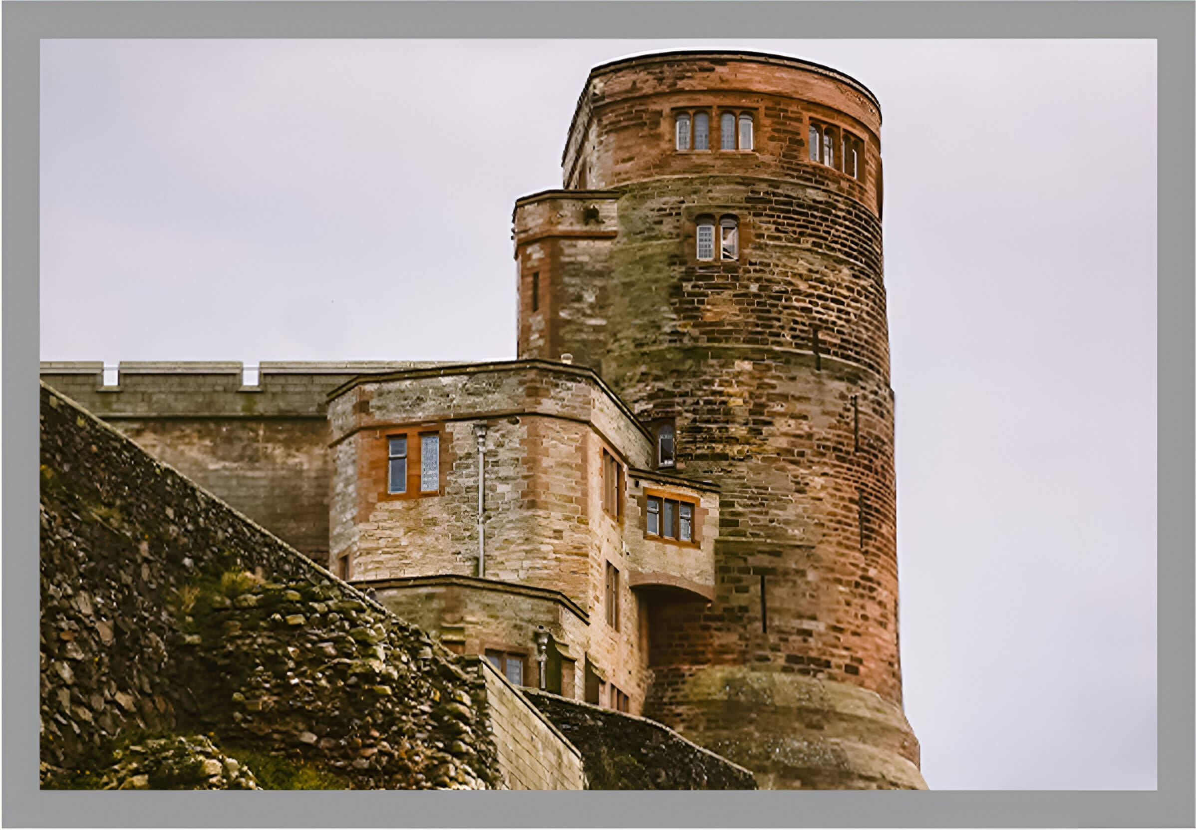 A castle like building with two windows and a tower.