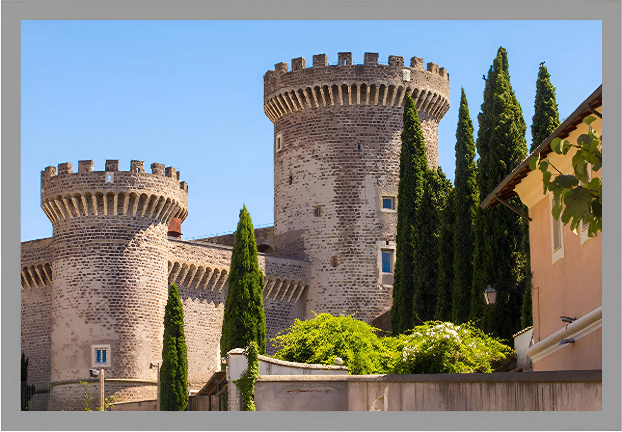 A castle with many towers and trees in front of it