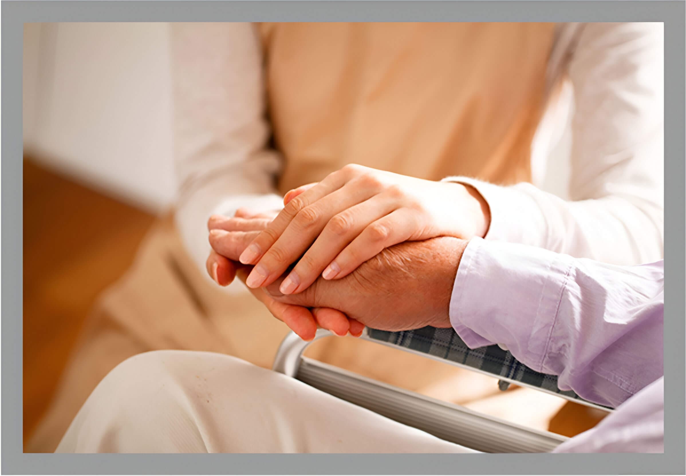 Two people holding hands in a room.